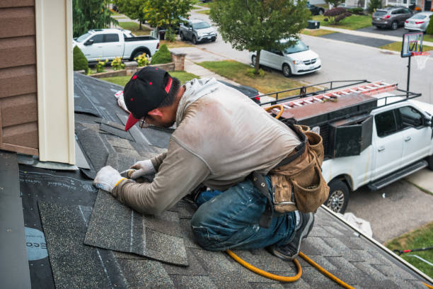 Professional Roofing technician working in Scarville, IA